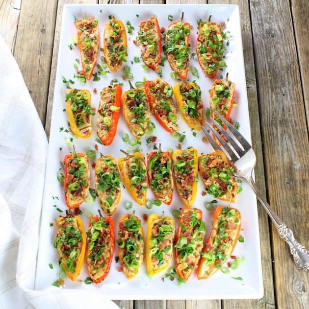 Cheesy Ranch Stuffed Mini Peppers lined up on a serving platter