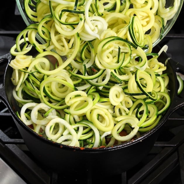 adding zucchini noodles to pot