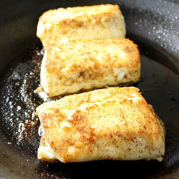 fish cooking in a saucepan