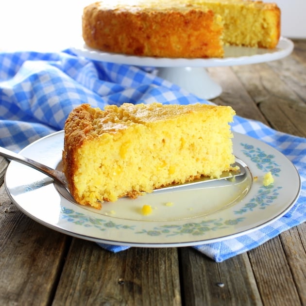 A slice of cornbread on a white plate