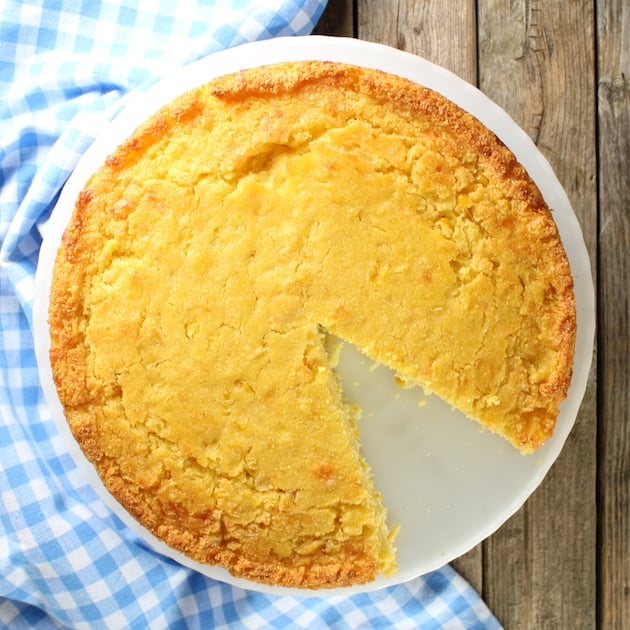 Plate with round loaf of caribbean cornbread