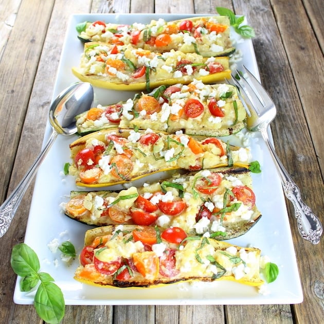 Platter of grilled squash stuffed with tomatoes and feta