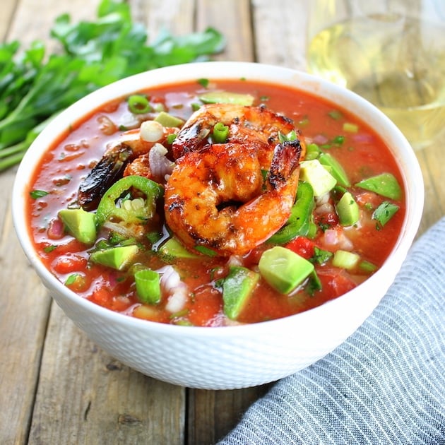 Eye level bowl of Classic Gazpacho with Spicy Grilled Shrimp