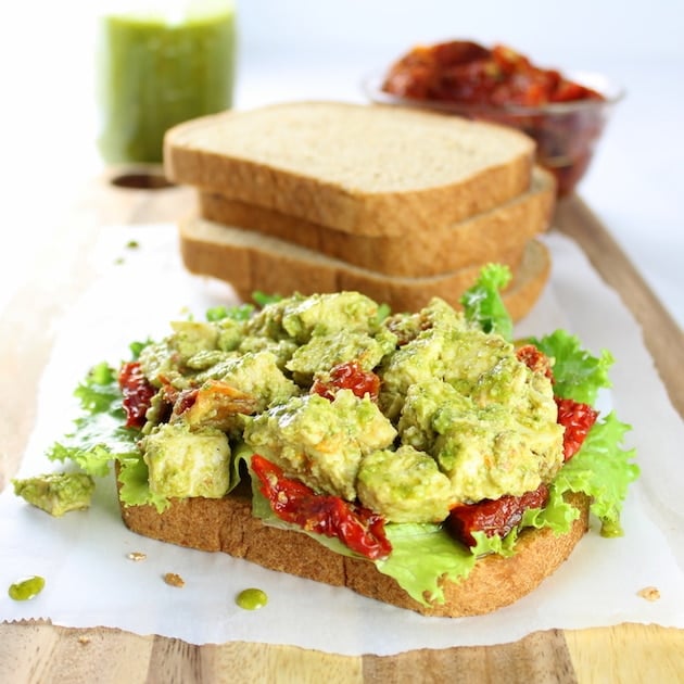 Open faced Chicken salad sandwich on a cutting board