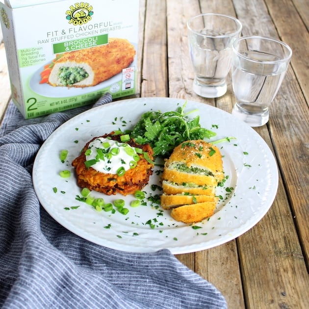 Dinner plate of Parmesan Sweet Potato Cakes With Broccoli Cheese Chicken