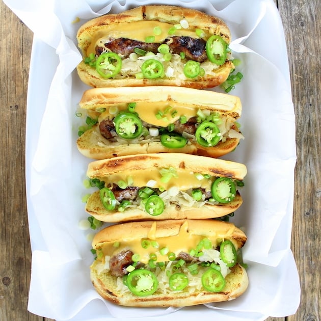 Group of Cheesy Brats with Fried Pickles