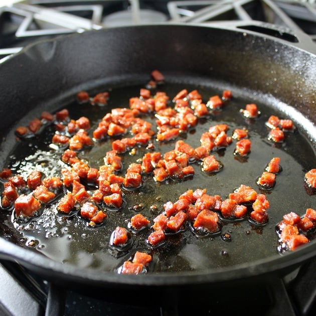Chorizo frying in a pan