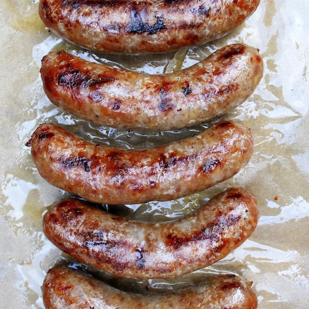 Grilled brats on a parchment paper