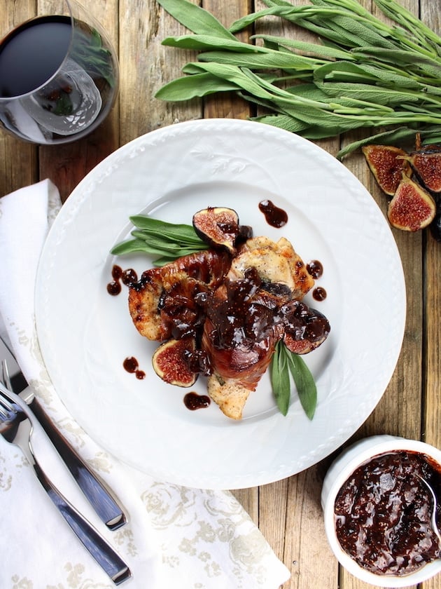 Plate of chicken with figs on a farm table