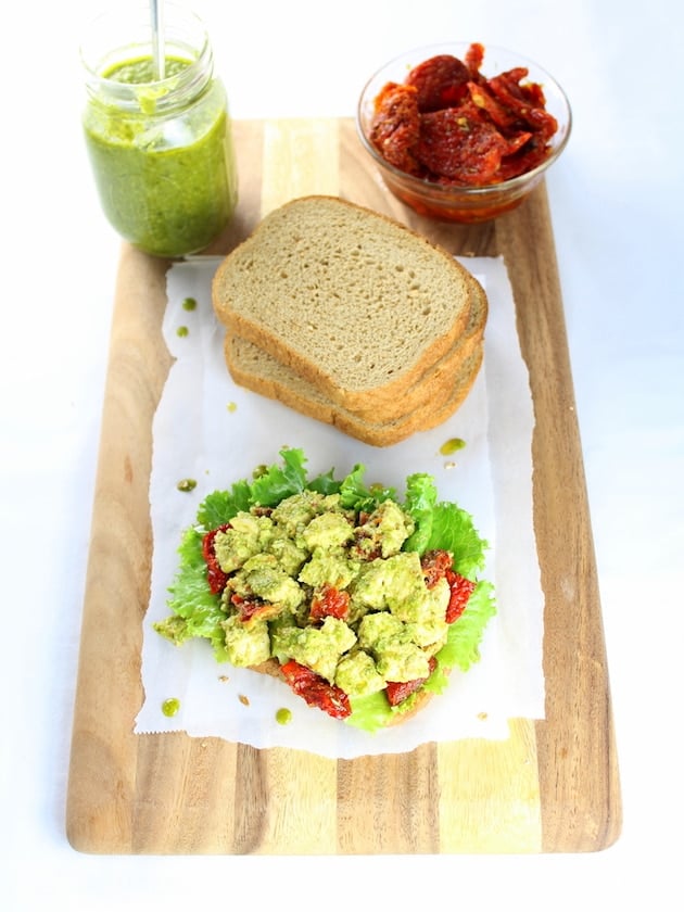 Open faced Chicken salad sandwich on a cutting board
