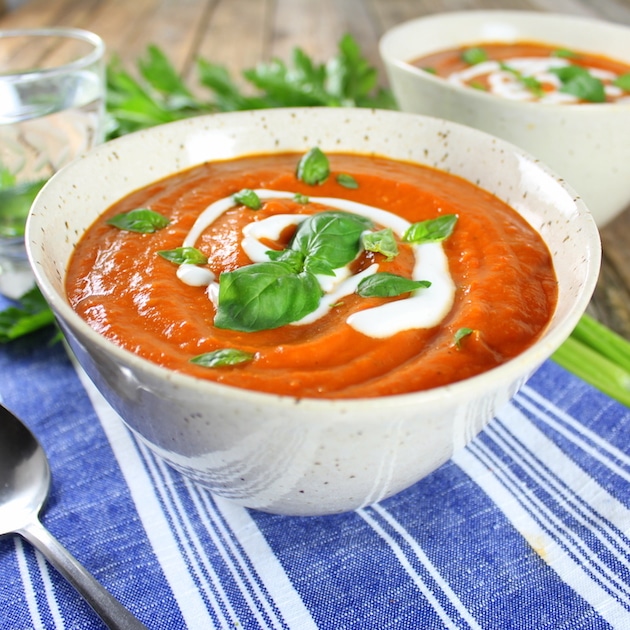 bowl of Smoky Harvest Tomato Soup with Mozzarella Crostini