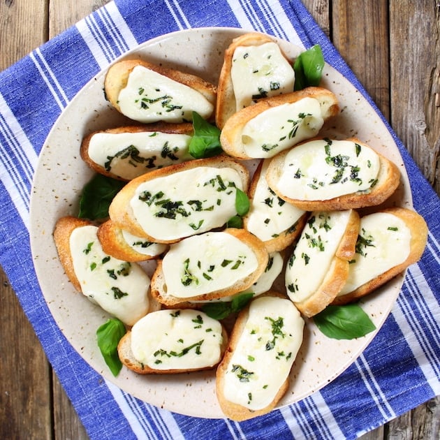 Crostini with mozzarella melted on