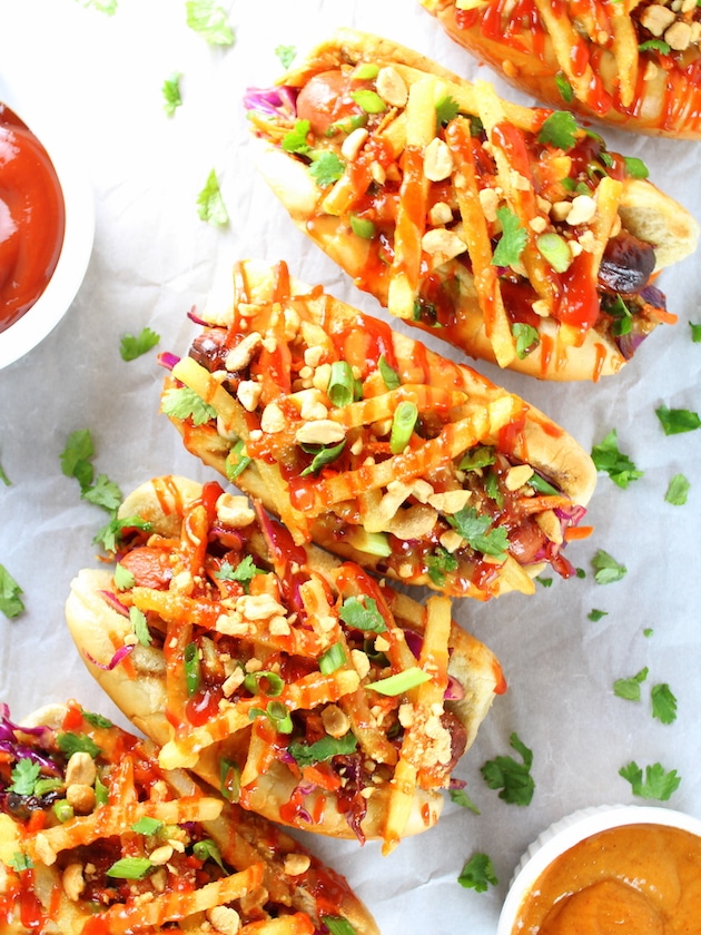 Asian hot dogs with slaw, french fries, spicy ketchup and peanuts