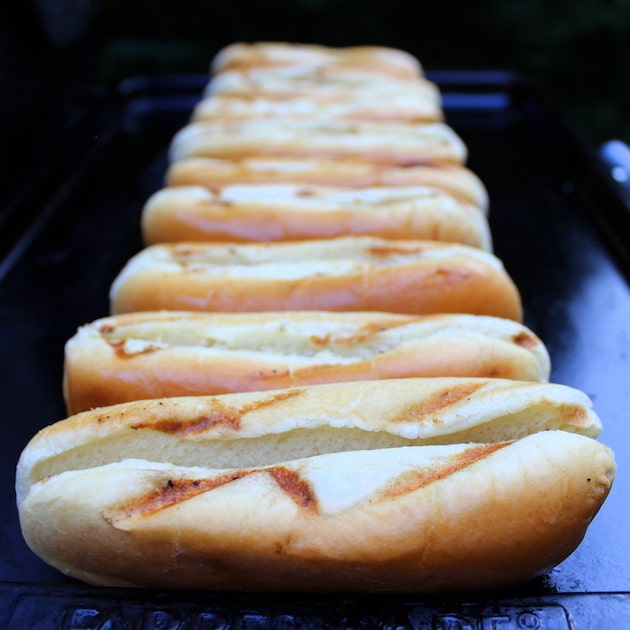 hot dog buns on the grill