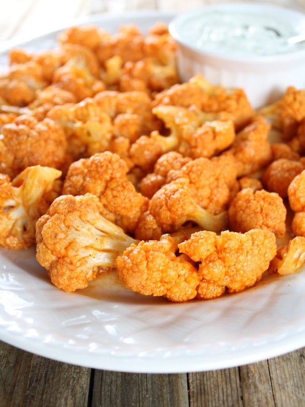 Eye level close up Roasted Buffalo Cauliflower with Blue Cheese Sauce