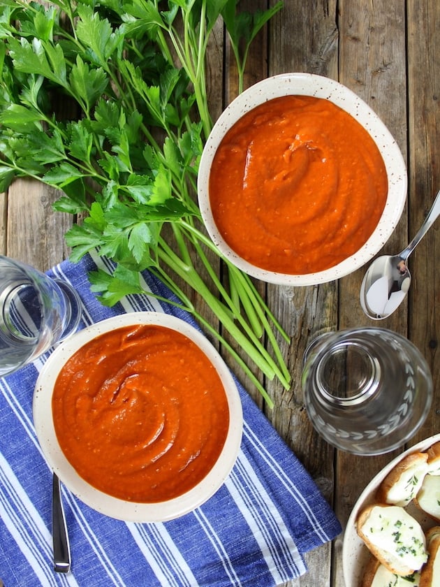 Two bowls of Smoky Harvest Tomato Soup with Mozzarella Crostini