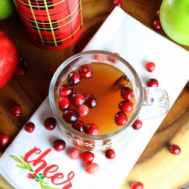 Warm Cranberry Apple Hard Cider with fresh cranberries