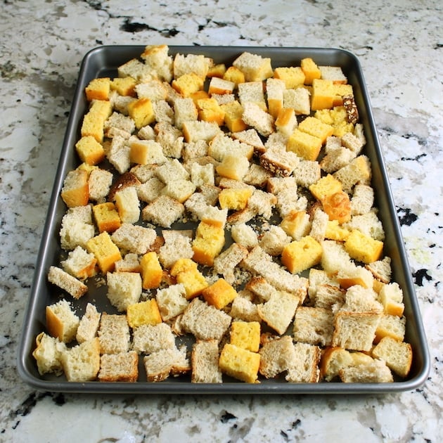 Cubed bread drying out on cookie sheet