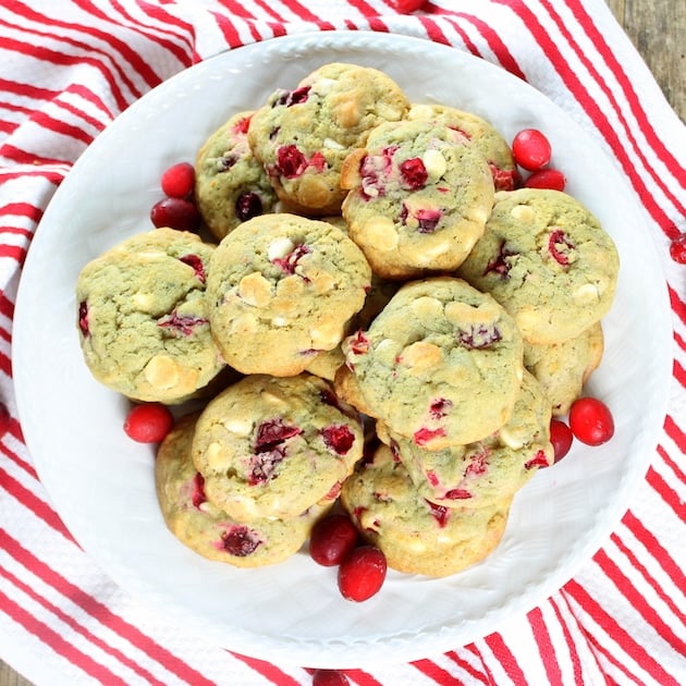 Cranberry Orange Cookies on a plate with red and white table cloth.