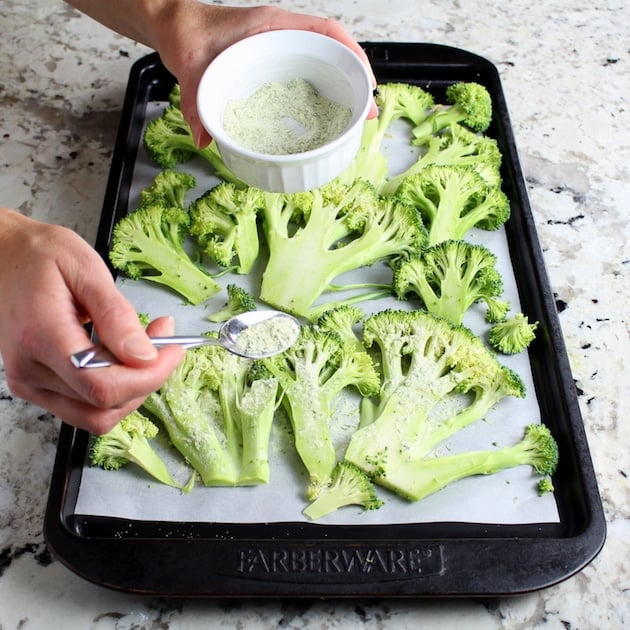 Baking sheet with sliced \"steaks\" of broccoli
