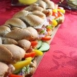 Eye level super long sub sandwich on holiday tablescape