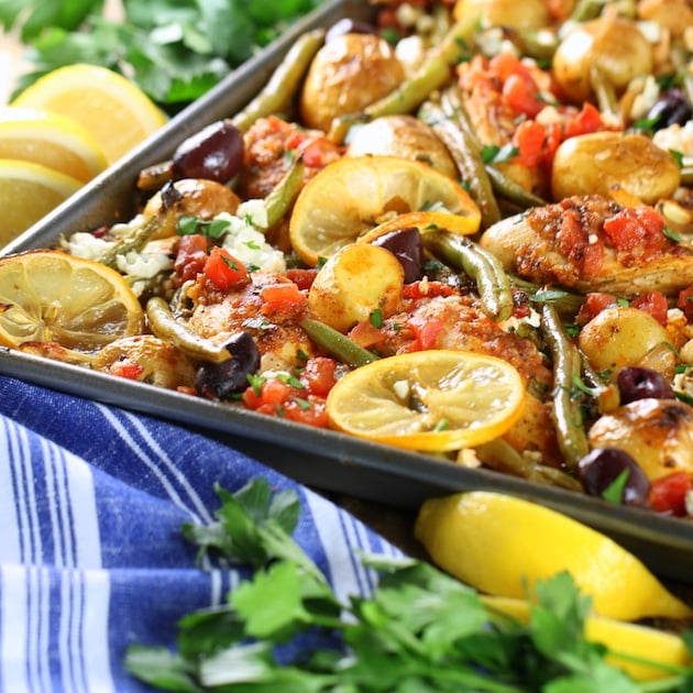 Eye level partial Greek Chicken Sheet Pan Dinner with Green Beans and Feta