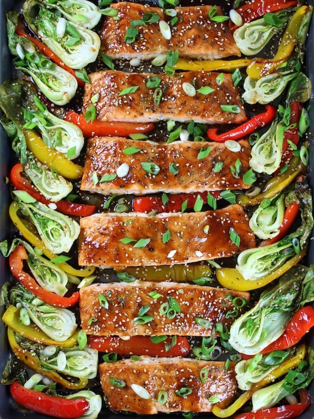 Sheet pan of Roasted Salmon with red & yellow peppers and baby bok choy