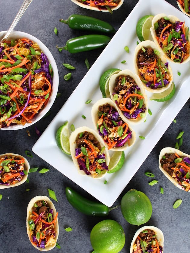 white rectangular platter of Korean Mini Taco Boats with Spicy Asian Slaw