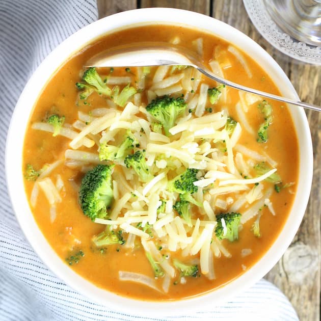 Smoky Cheesy Cauliflower and Broccoli Soup with shredded cheese