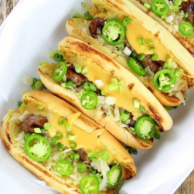 Cheesy Beer Brats lined up in a dish