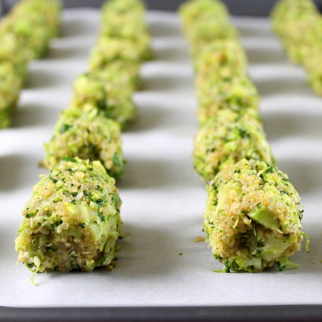 Baked Veggie Quinoa Tots linked up on parchment paper before cooking