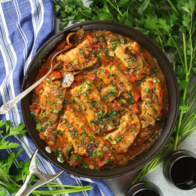 Pan of Chicken Cannelloni with parsley garnish