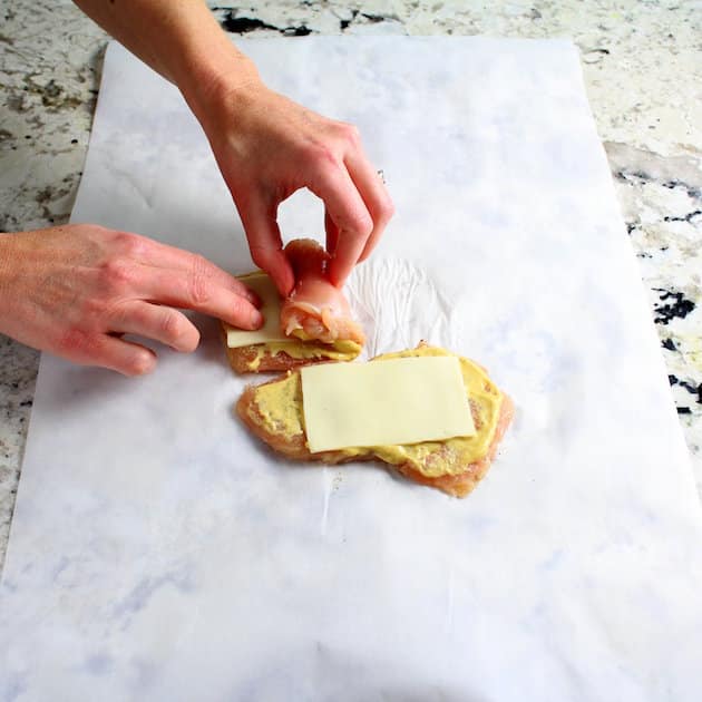 Rolling up Chicken Cannelloni before cooking