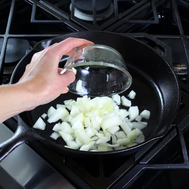 Adding onions to skillet