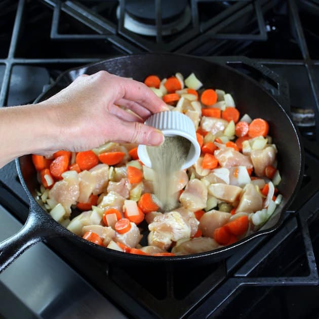 Adding seasonings to skillet