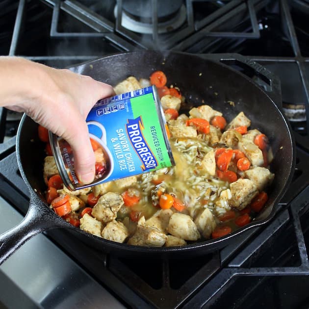 Adding canned soup to skillet