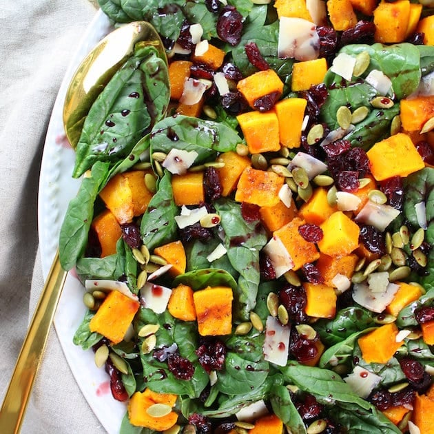 Cubed Butternut Squash and cranberries on spinach salad 