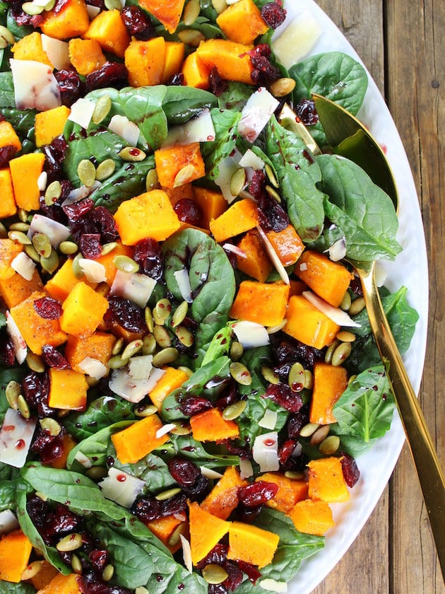 Partial platter of salad with Roasted Butternut Squash, Cranberry and Spinach Salad with a Cran-Cabernet Dressing