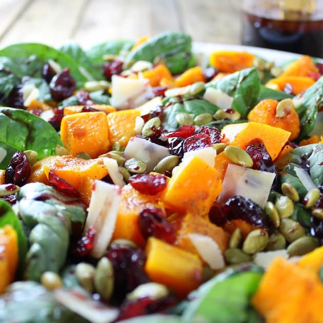 Close up of Roasted Butternut Squash, Cranberry and Spinach Salad with a Cran-Cabernet Dressing