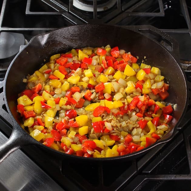 breakfast skillet cooking peppers and sausage