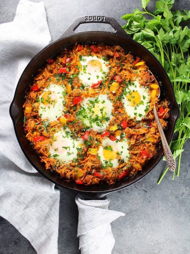 Breakfast skillet with chicken sausage and sunny side up eggs