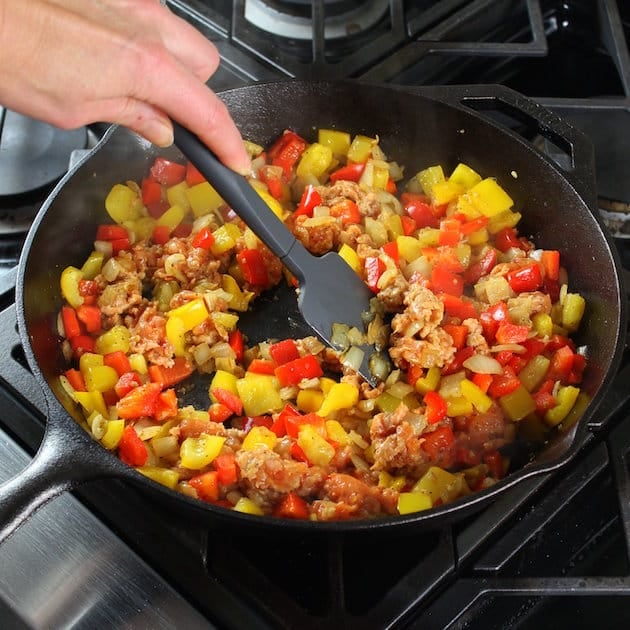 Stirring a breakfast skillet 