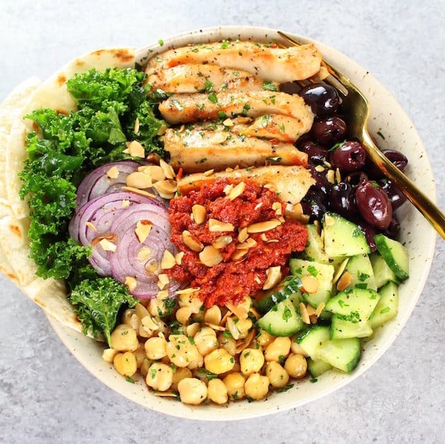 Chicken Kale Energy Bowl with Italian Sun-Dried Tomato Sauce Image - Low carb salad packed with protein, veggies, grains and lots of fiber! Easy weeknight dinner.