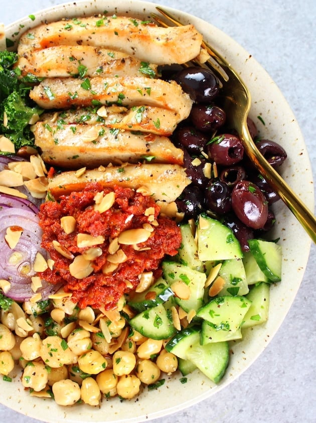 Close up partial bowl of Chicken Kale salad 