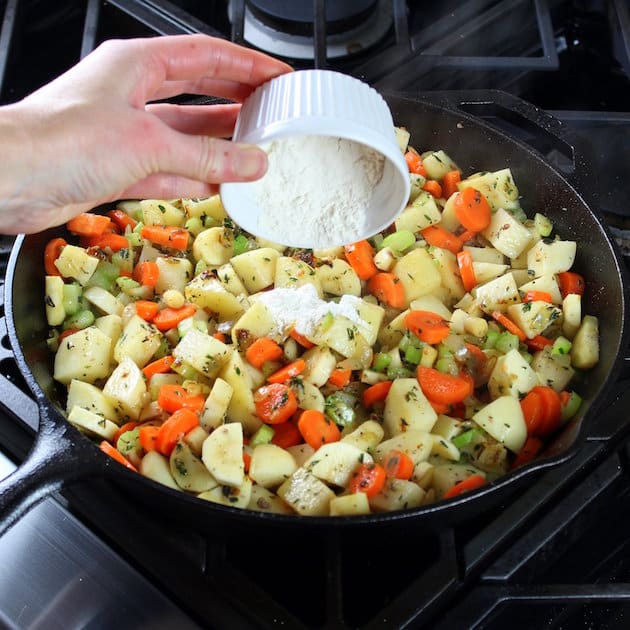 Adding flour to skillet