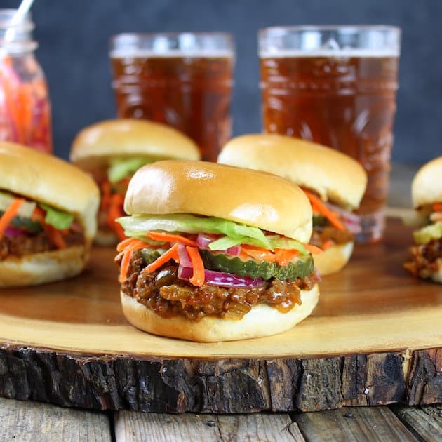 Asian Sloppy Joes with Pickled Carrots and Onions on a table