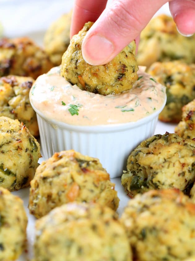 Dipping a tuna cake in yogurt sauce