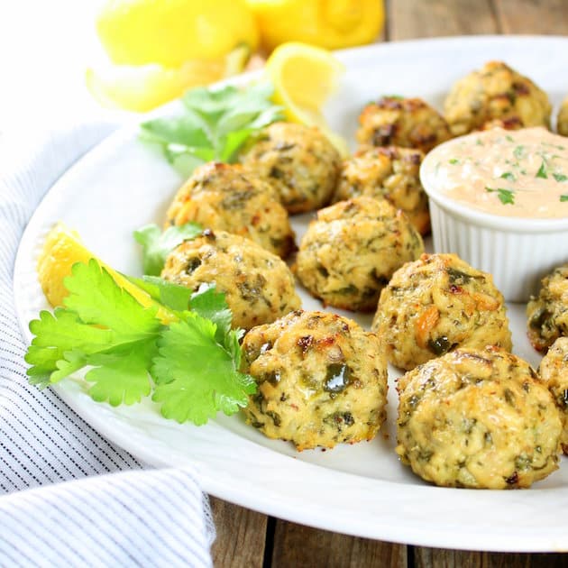 Partial platter of tuna cakes with spicy yogurt sauce