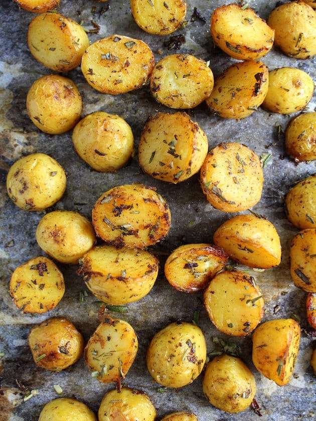 salty herbed potatoes roasted on a baking sheet