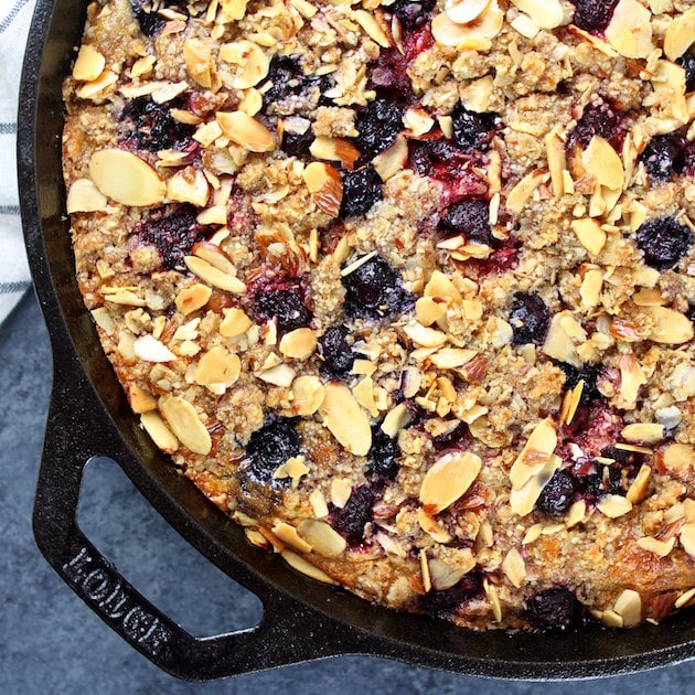 partial skillet cake with triple berry crumble